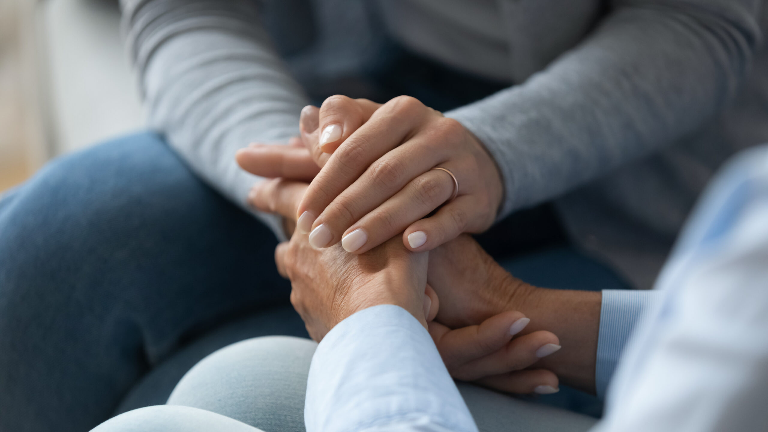 Two sets of interlaced hands