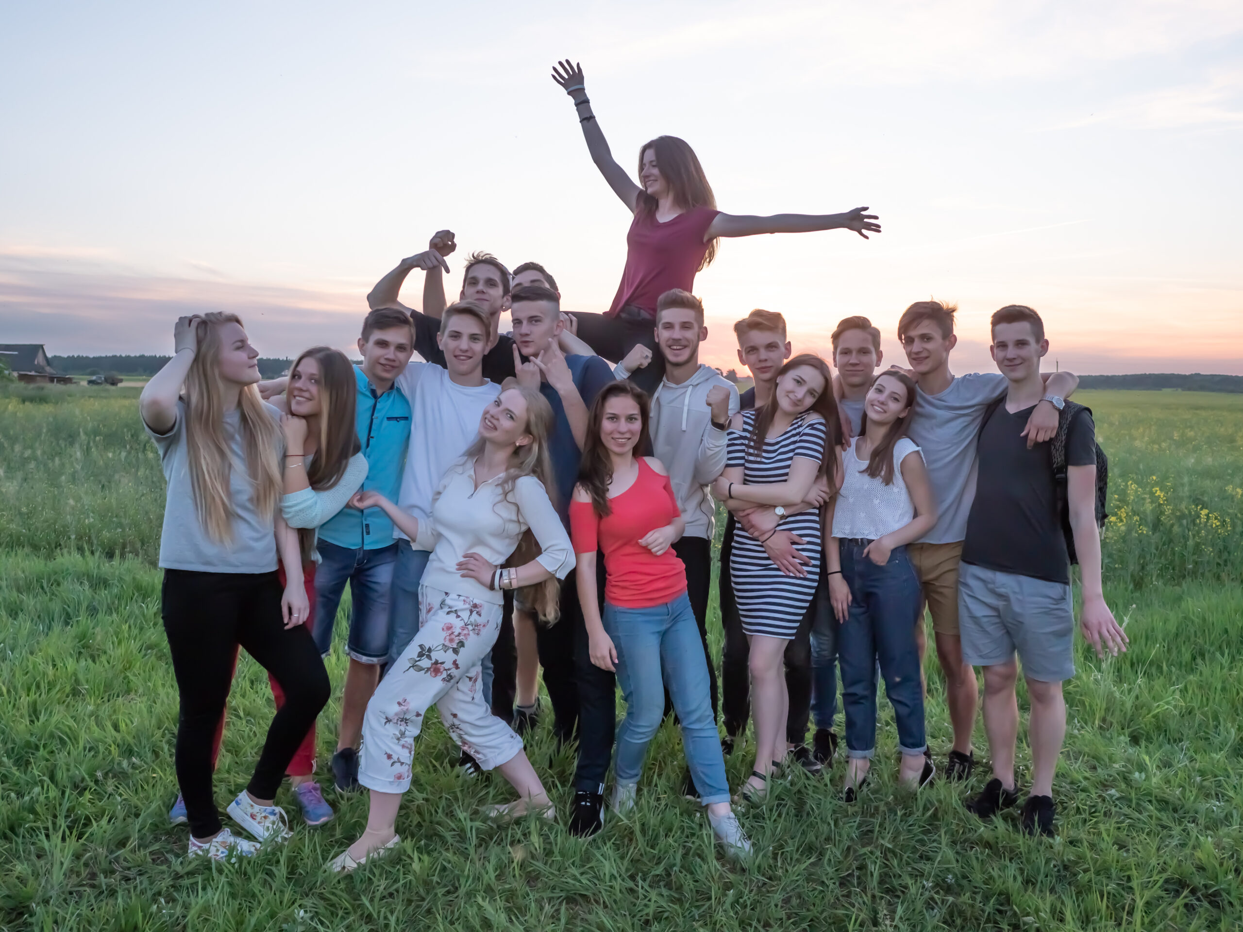 Friendly friends posing outdoors in the evening